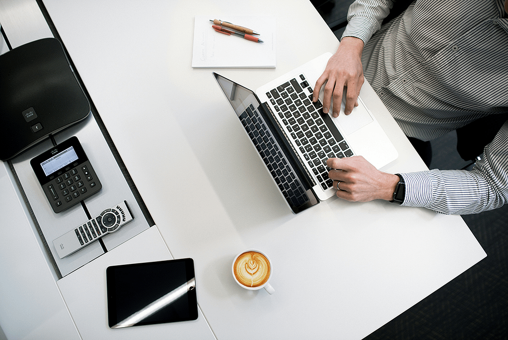 man on a laptop at a desk